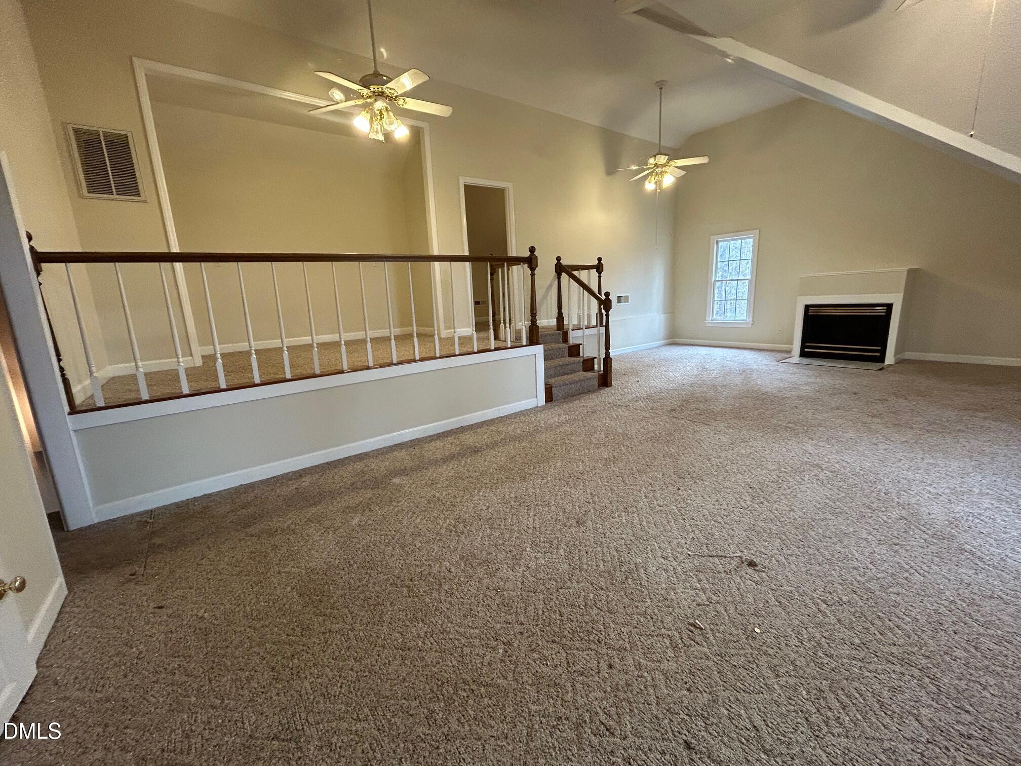 1220 Oxford Loop Road Oxford, NC 27565 - Photo 27 of 30 a view of a livingroom with furniture and a ceiling fan
