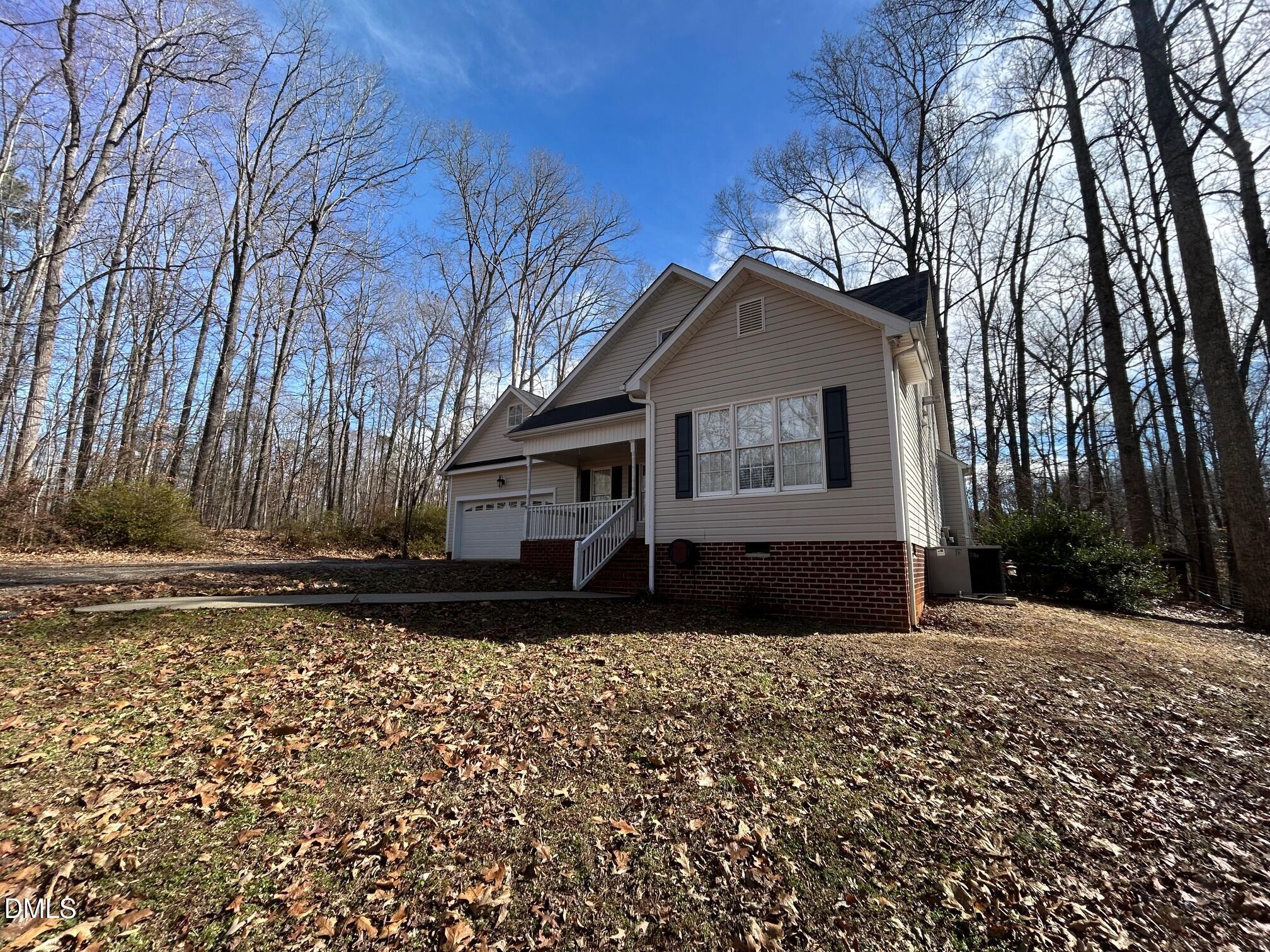 1220 Oxford Loop Road Oxford, NC 27565 - Photo 4 of 30 a front view of a house with a yard