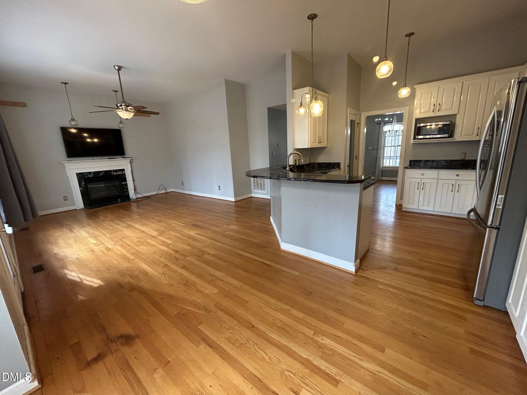 1220 Oxford Loop Road Oxford, NC 27565 - Photo 7 of 30 a kitchen with stainless steel appliances a refrigerator sink and microwave
