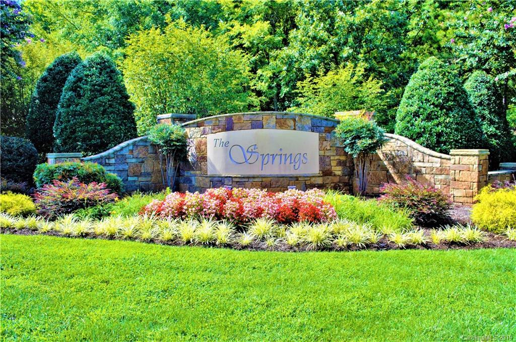 409 Sierra Trace Road, Unit 73 Denton, NC 27239 - Photo 17 of 34 a sign that is in front of flowers