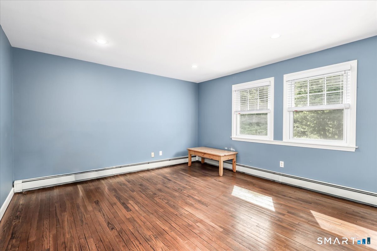 19 Botsford Hill Road Newtown, CT 06470 - Photo 25 of 40 a view of room with window and wooden floor