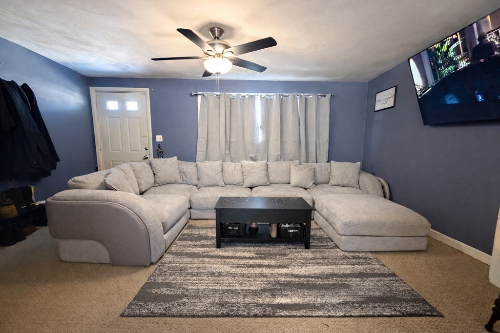 133 Ardsley Circle Brockton, MA 02302 - Photo 4 of 16 a living room with furniture and a large window