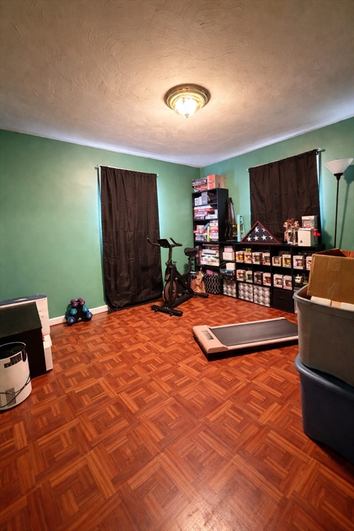 133 Ardsley Circle Brockton, MA 02302 - Photo 9 of 16 a bedroom with a bed and a table in it