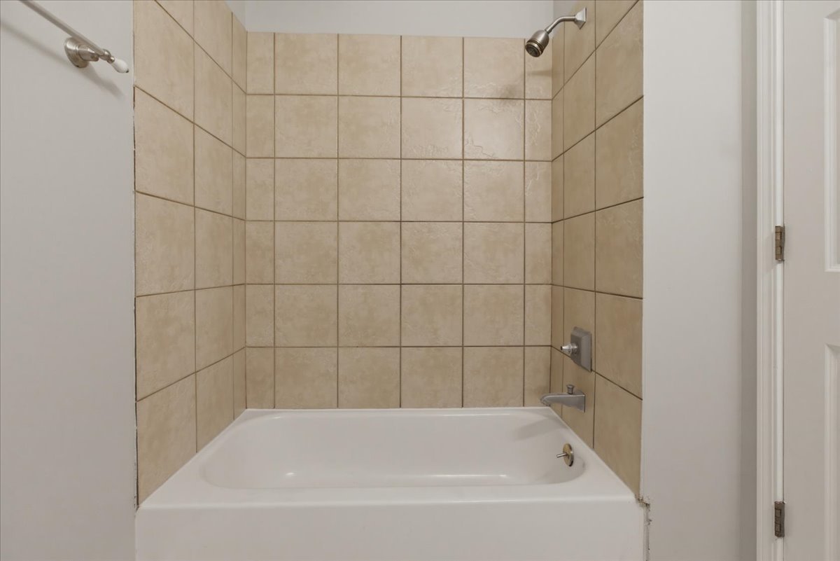 7039 West Roosevelt Road, Unit 2F Oak Park, IL 60402 - Photo 12 of 12 a bathroom with a bathtub