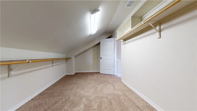 a view of a livingroom with a ceiling fan and window
