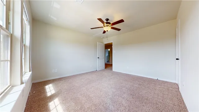 a bathroom with a toilet sink a mirror and vanity