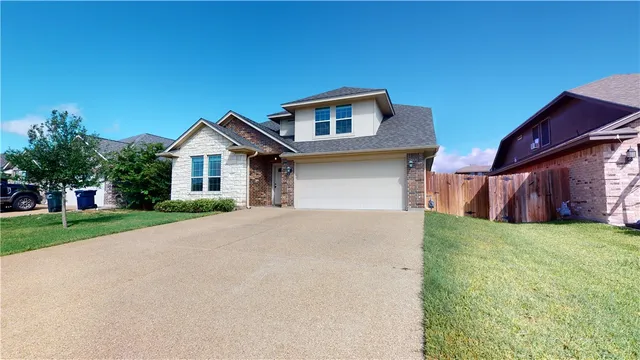 a house view with a garden space