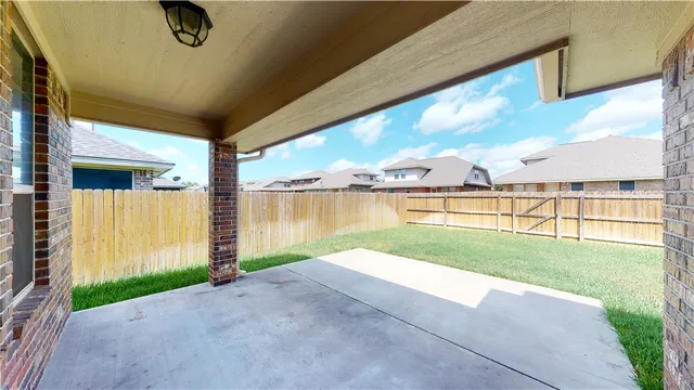 a white toilet sitting next to a wooden cabinet