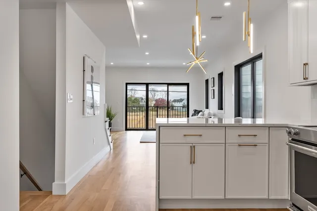 a spacious bathroom with a double vanity sink a large mirror and a shower
