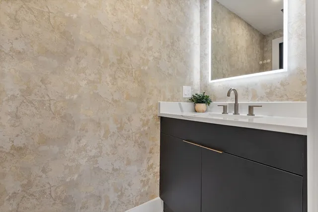 a bathroom with a sink and a mirror