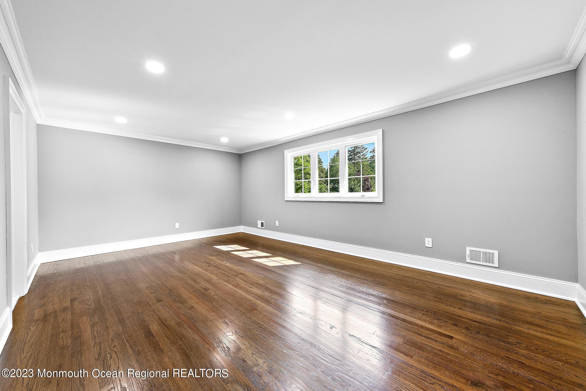2 Heathcliff Road Rumson, NJ 07760 - Photo 29 of 38 a view of empty room with wooden floor and fan