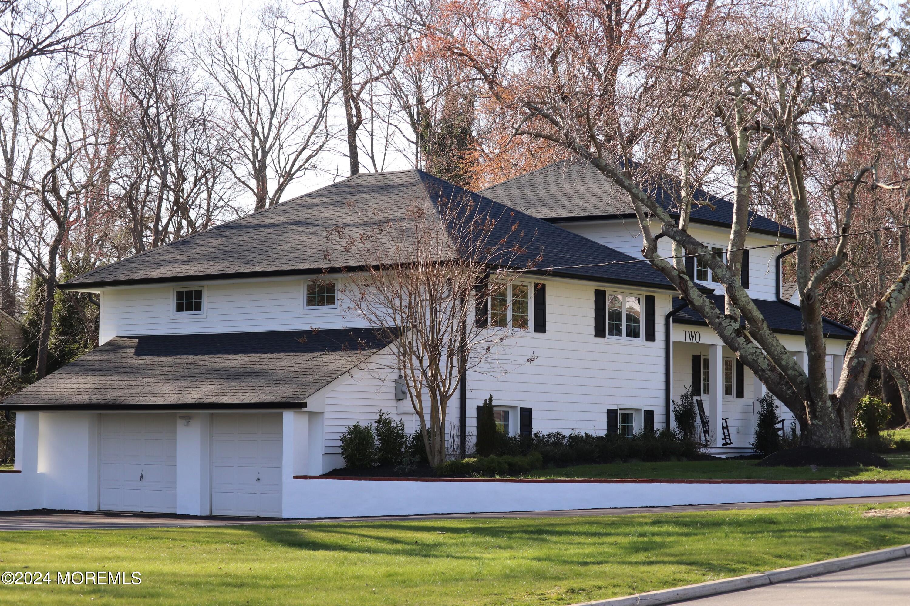 2 Heathcliff Road Rumson, NJ 07760 - Photo 5 of 38 a front view of house with yard and trees in the background