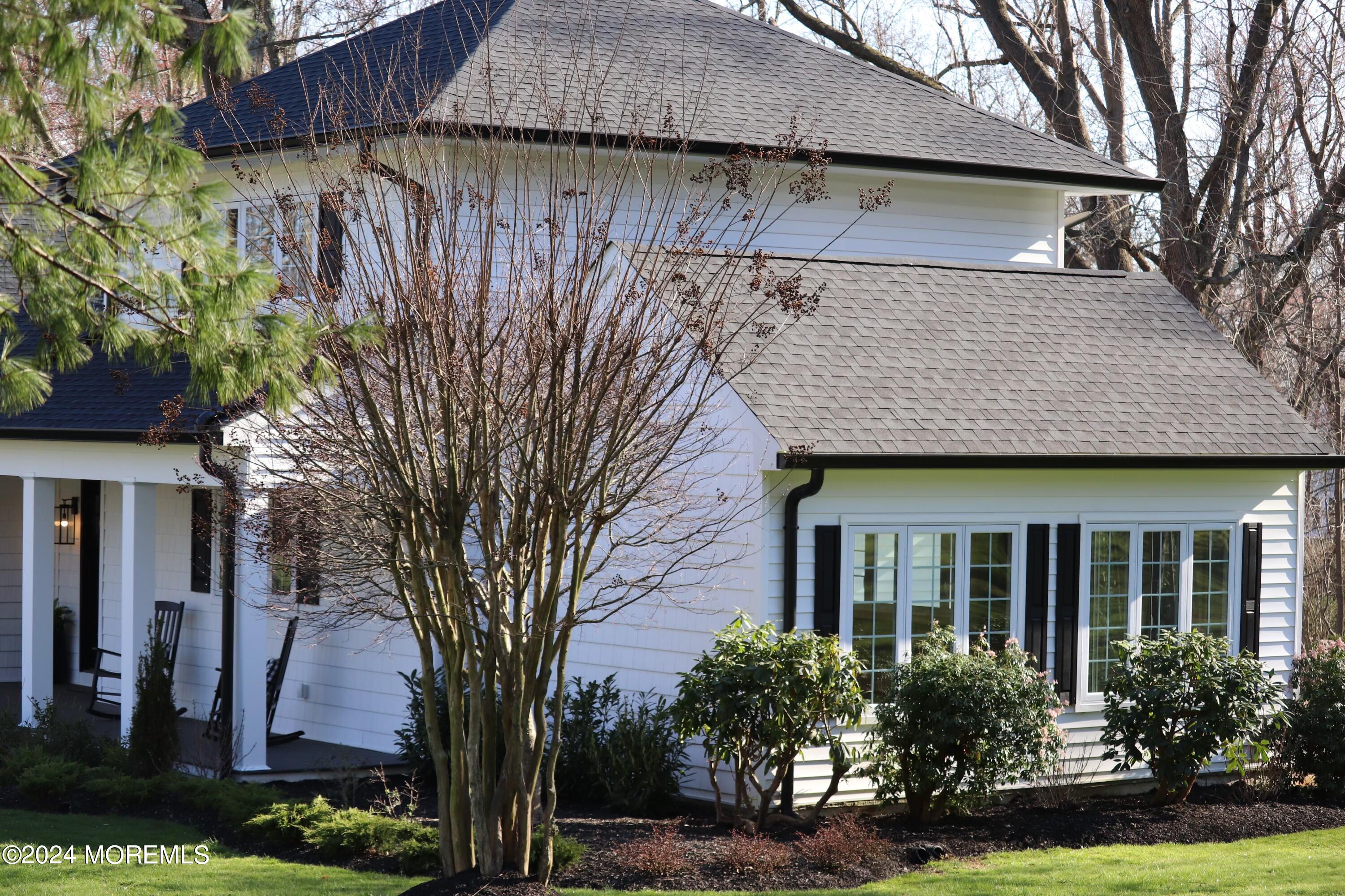 2 Heathcliff Road Rumson, NJ 07760 - Photo 6 of 38 a front view of a house with garden