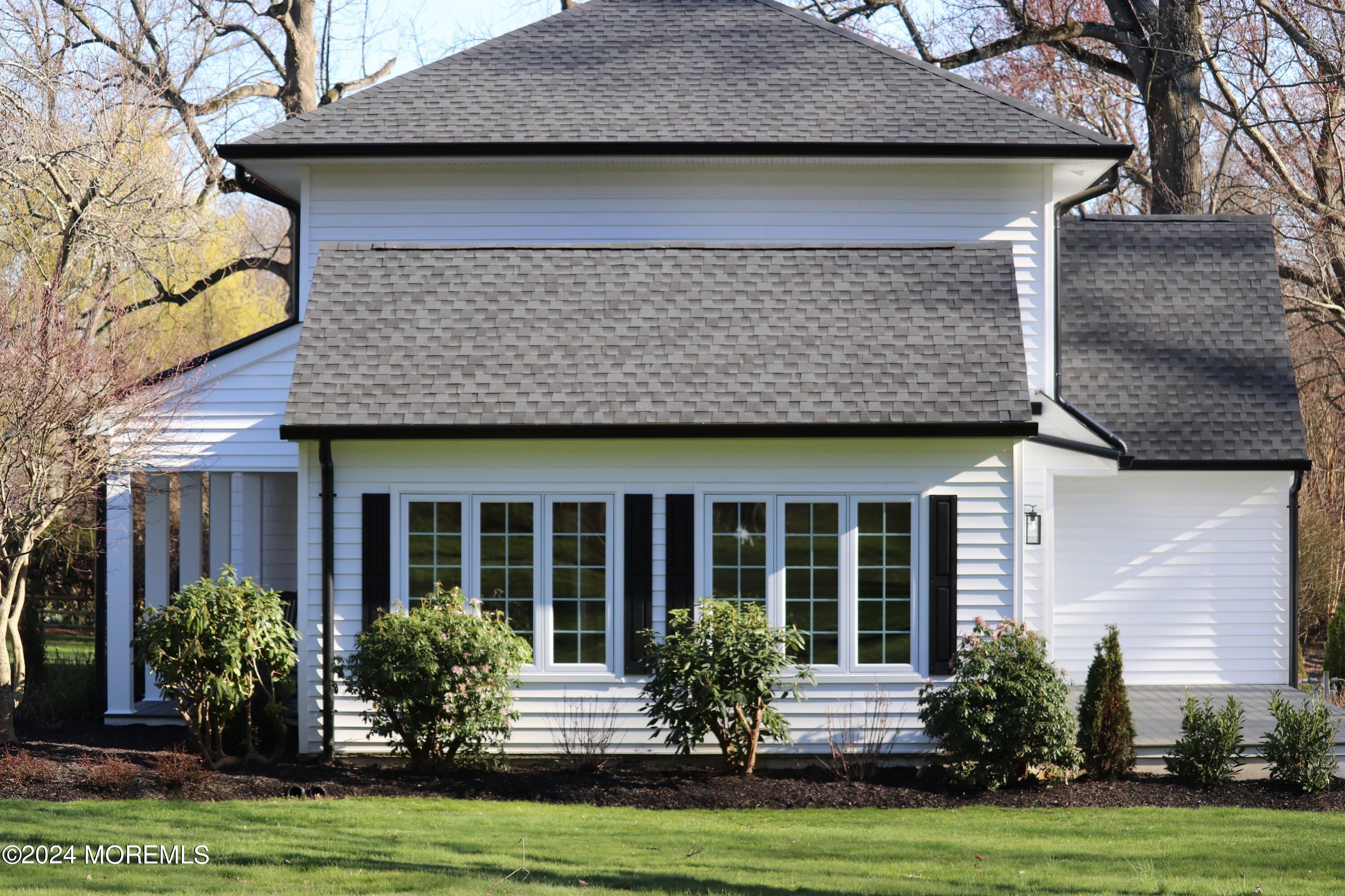 2 Heathcliff Road Rumson, NJ 07760 - Photo 7 of 38 a front view of a house with garden
