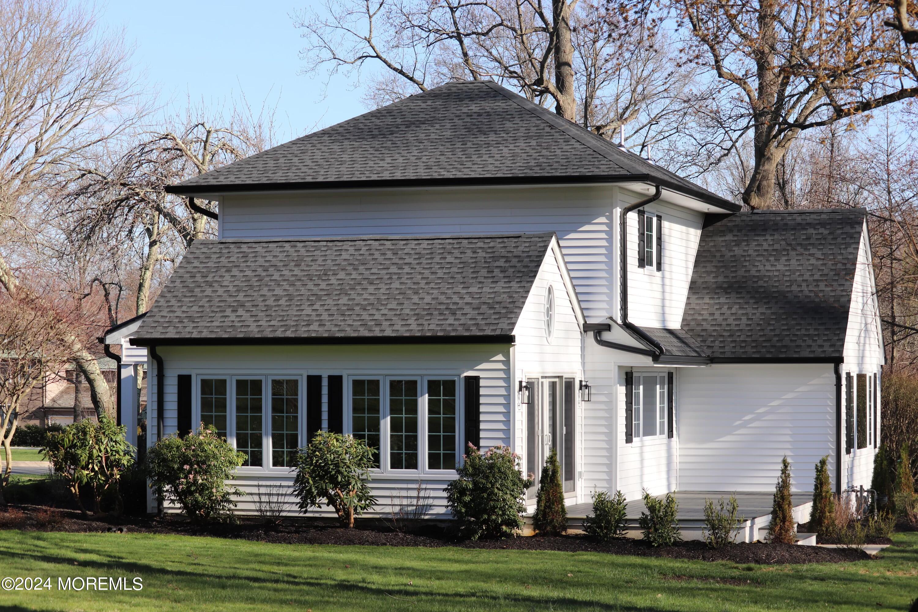 2 Heathcliff Road Rumson, NJ 07760 - Photo 8 of 38 a front view of a house with garden