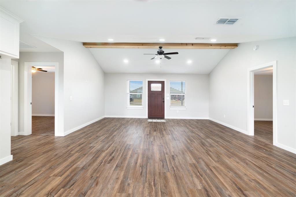 19 Private Road Paris, TX 75460 - Photo 6 of 18 wooden floor in an empty room with a window