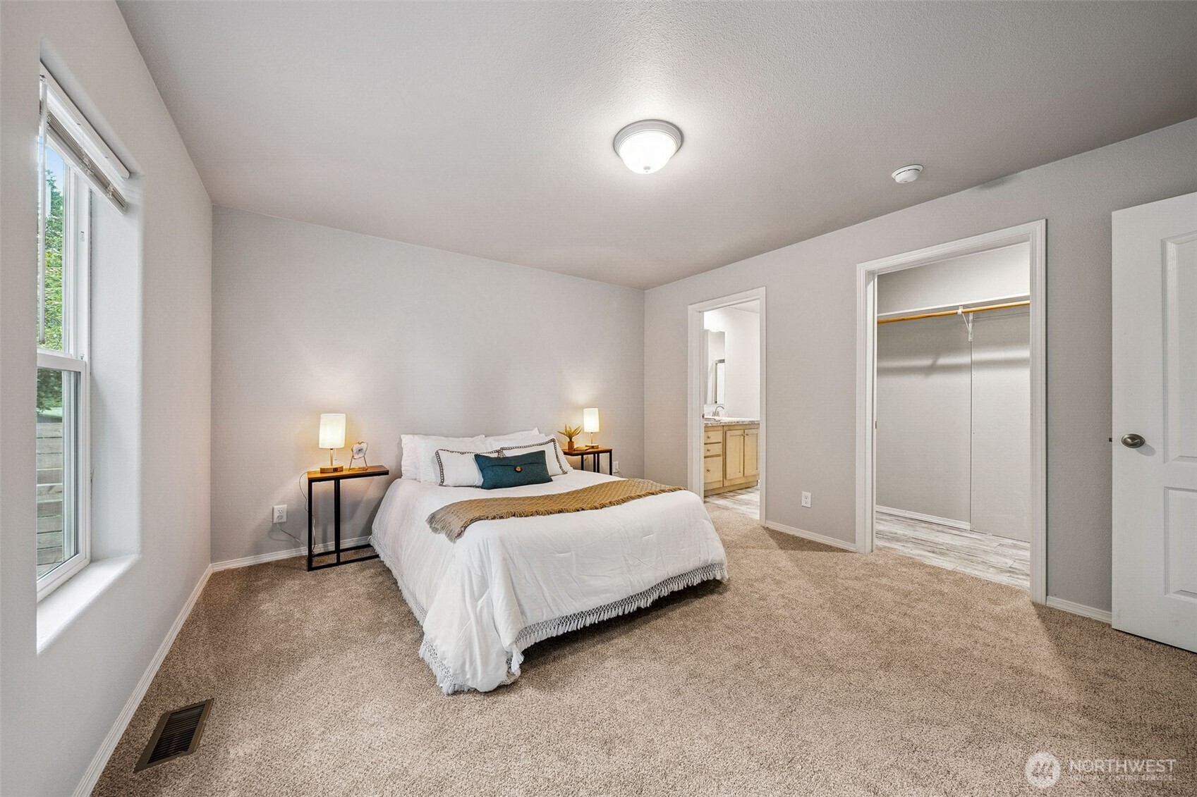 8107 Mazama Court Southwest Olympia, WA 98512 - Photo 14 of 34 a bedroom with a bed and a large window