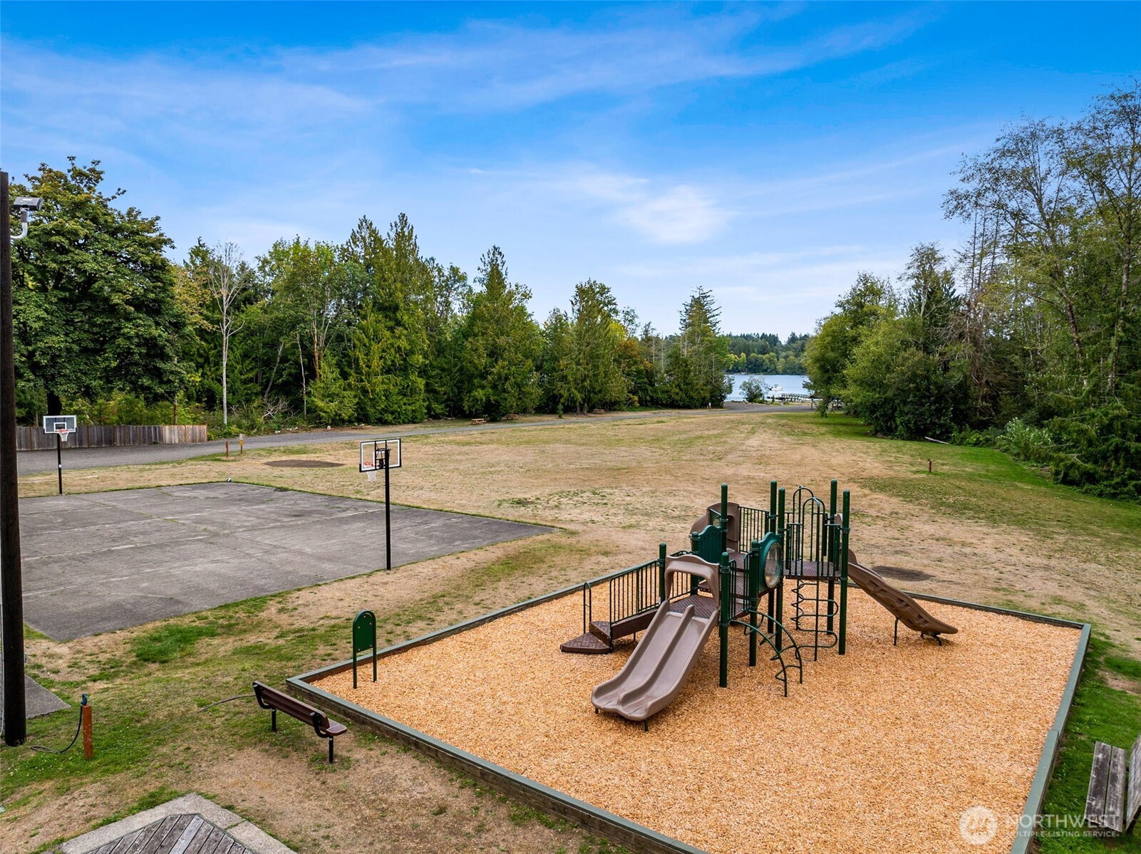 8107 Mazama Court Southwest Olympia, WA 98512 - Photo 30 of 34 a view of a swimming pool with a patio and a yard