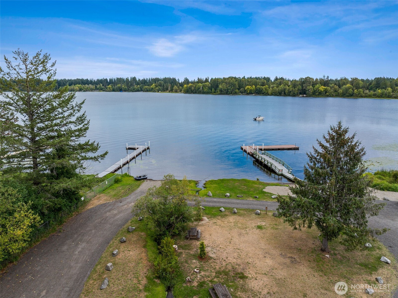 8107 Mazama Court Southwest Olympia, WA 98512 - Photo 32 of 34 a view of a lake with houses in the back