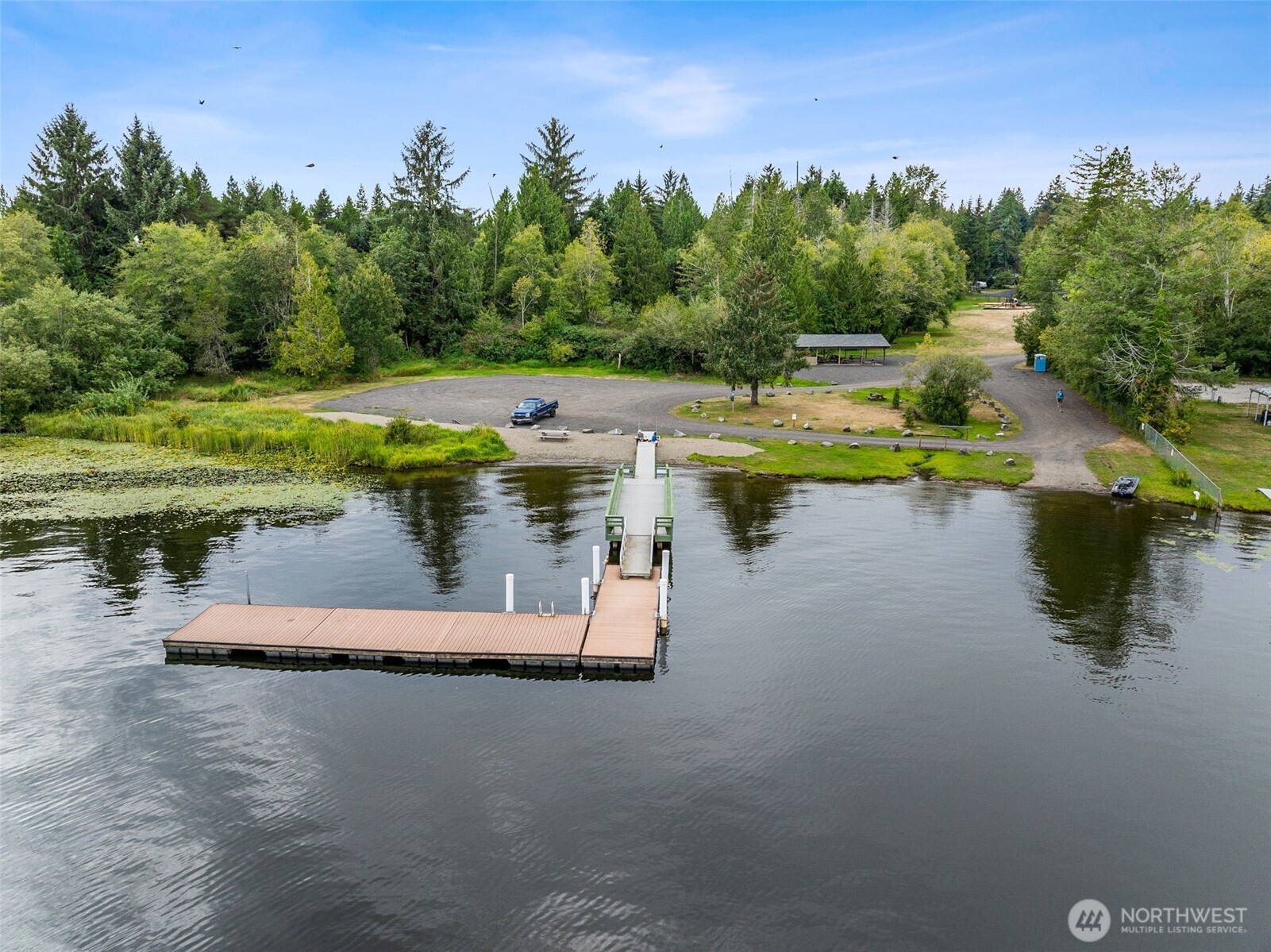 8107 Mazama Court Southwest Olympia, WA 98512 - Photo 33 of 34 a view of a swimming pool with a yard and lake view