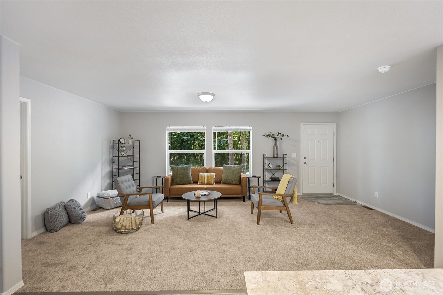 8107 Mazama Court Southwest Olympia, WA 98512 - Photo 4 of 34 a living room with furniture and a large window