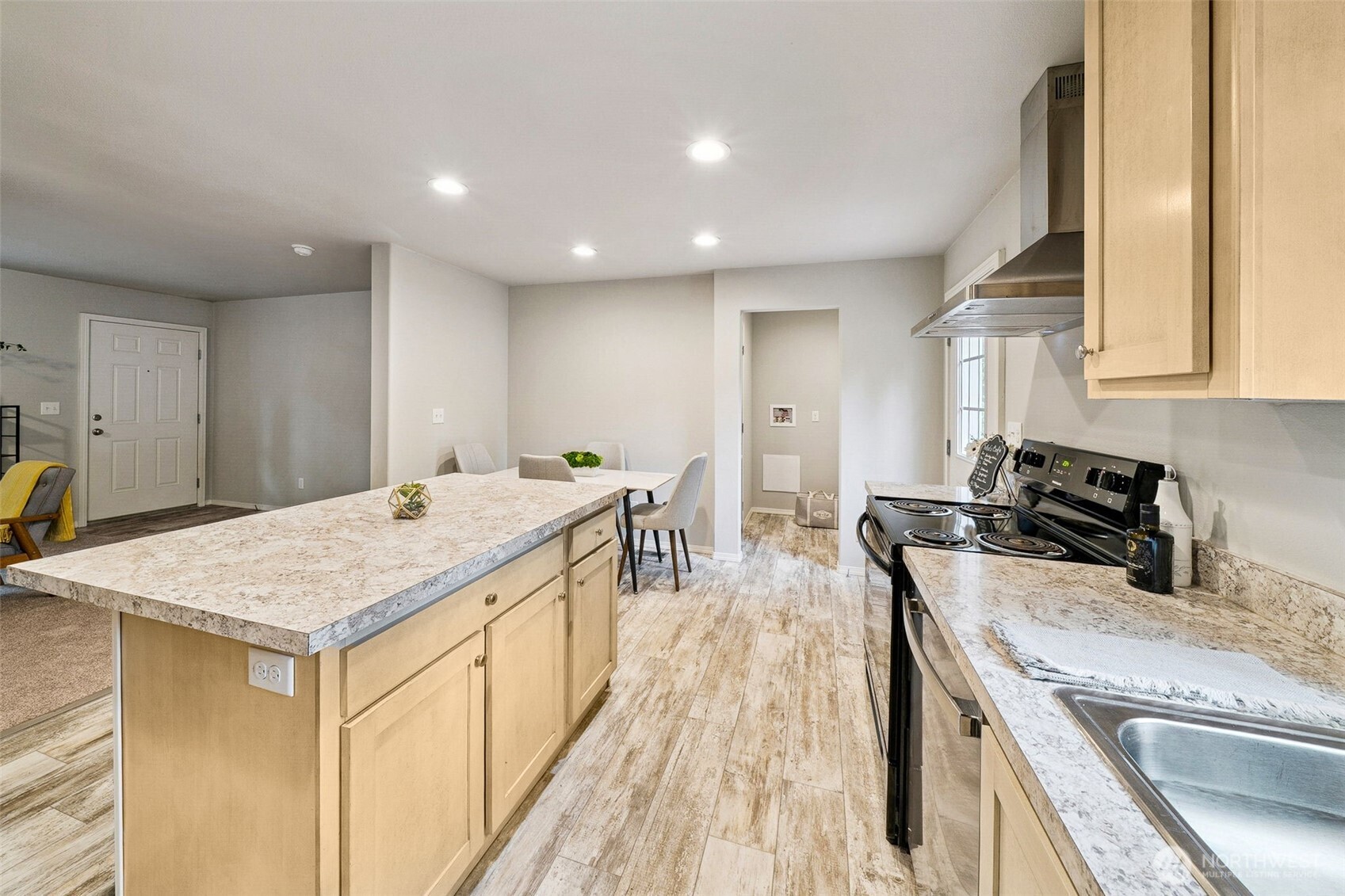 8107 Mazama Court Southwest Olympia, WA 98512 - Photo 9 of 34 a kitchen with a stove and a sink
