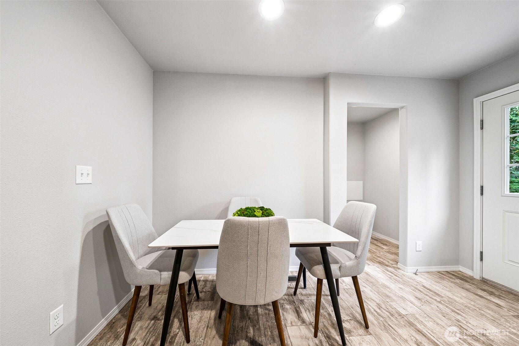 8107 Mazama Court Southwest Olympia, WA 98512 - Photo 10 of 34 a view of a dining room with furniture and wooden floor