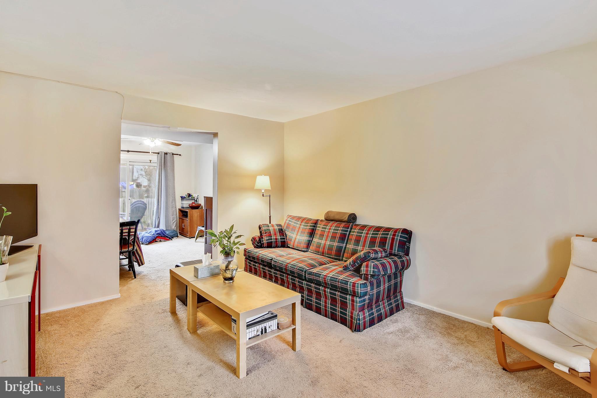 19406 Thomas Farm Road Gaithersburg, MD 20886 - Photo 2 of 15 a living room with furniture and a couch