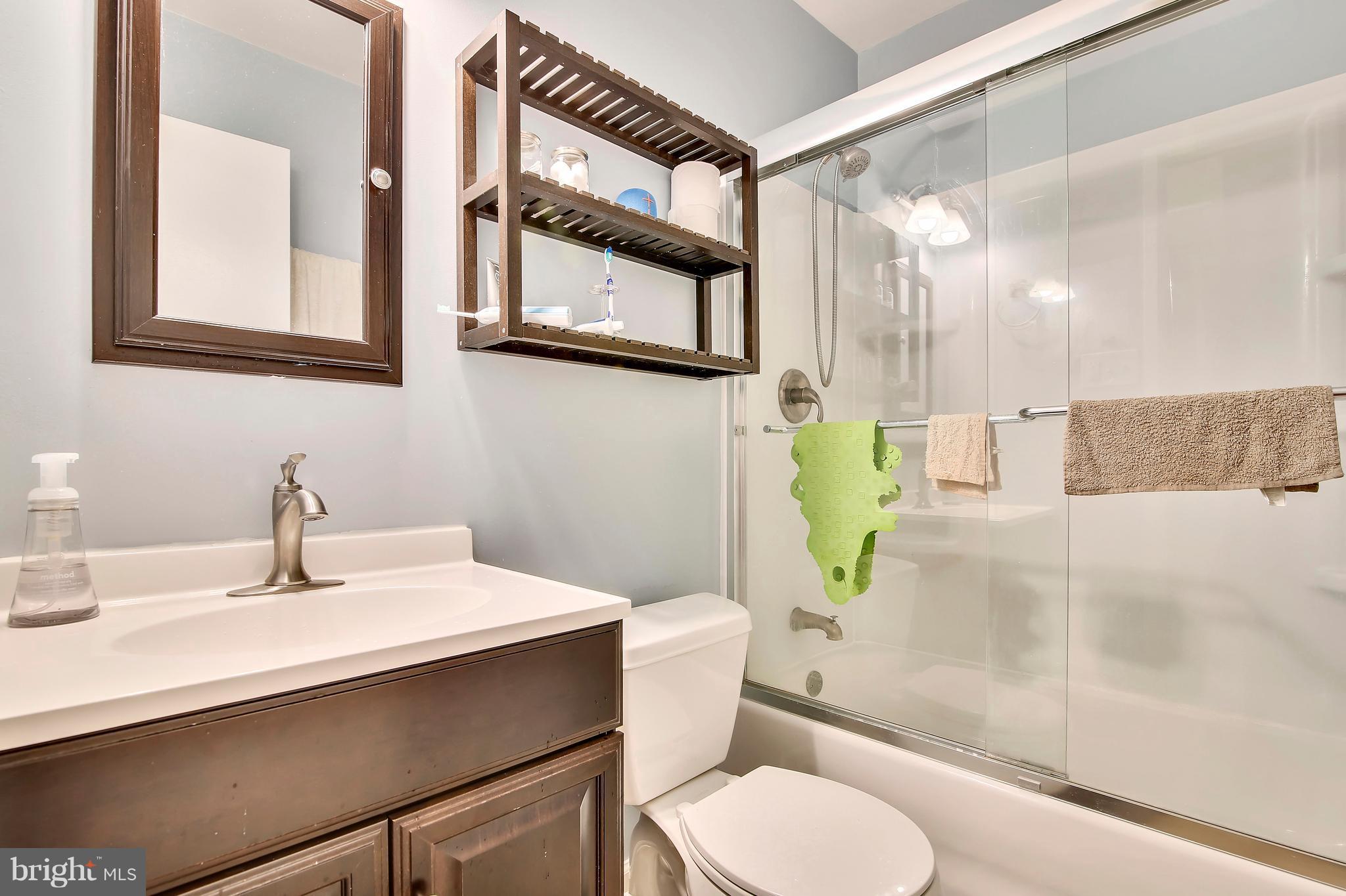 19406 Thomas Farm Road Gaithersburg, MD 20886 - Photo 14 of 15 a bathroom with a sink toilet and shower