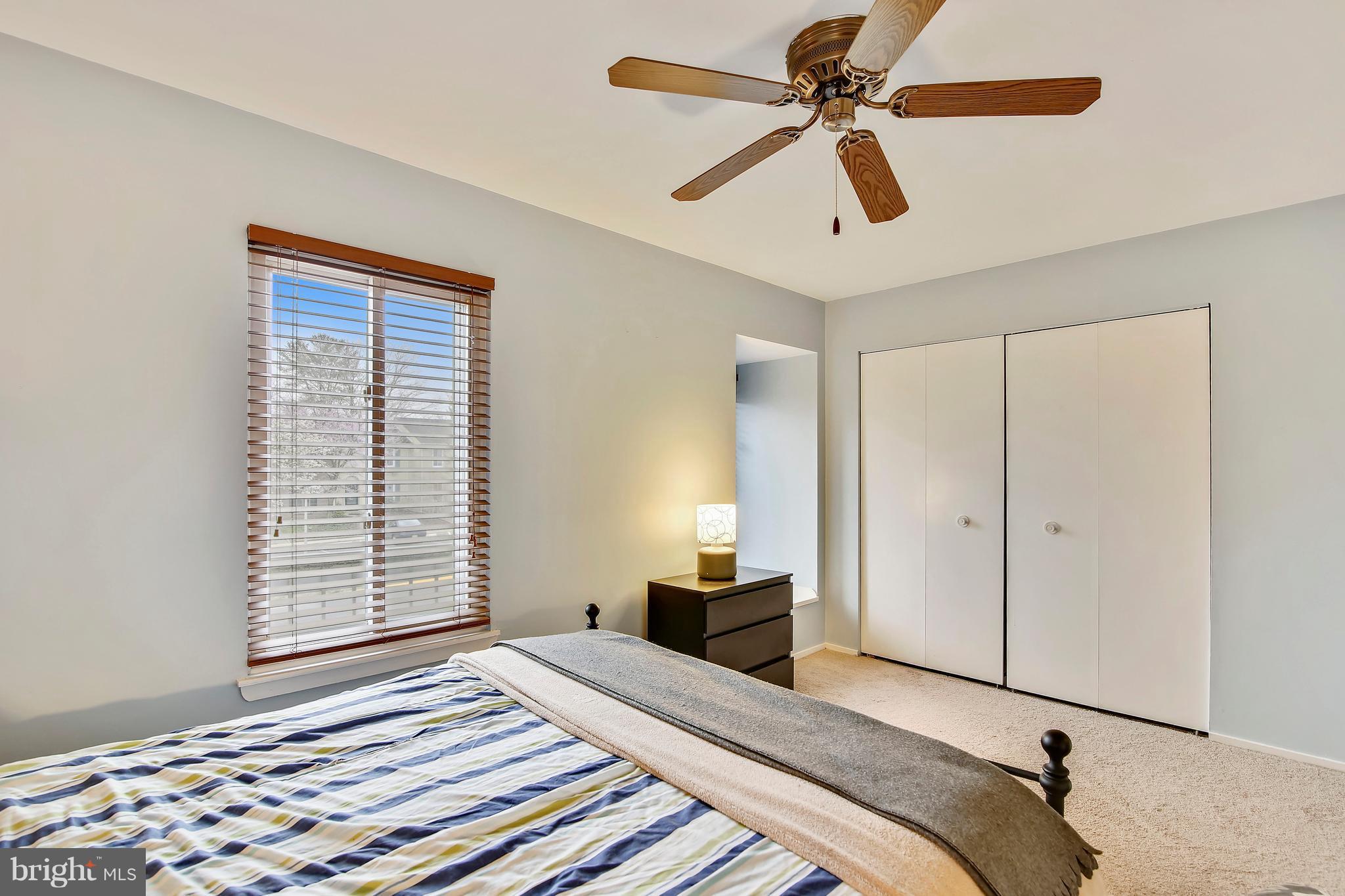 19406 Thomas Farm Road Gaithersburg, MD 20886 - Photo 10 of 15 a bedroom with a bed and a chandelier