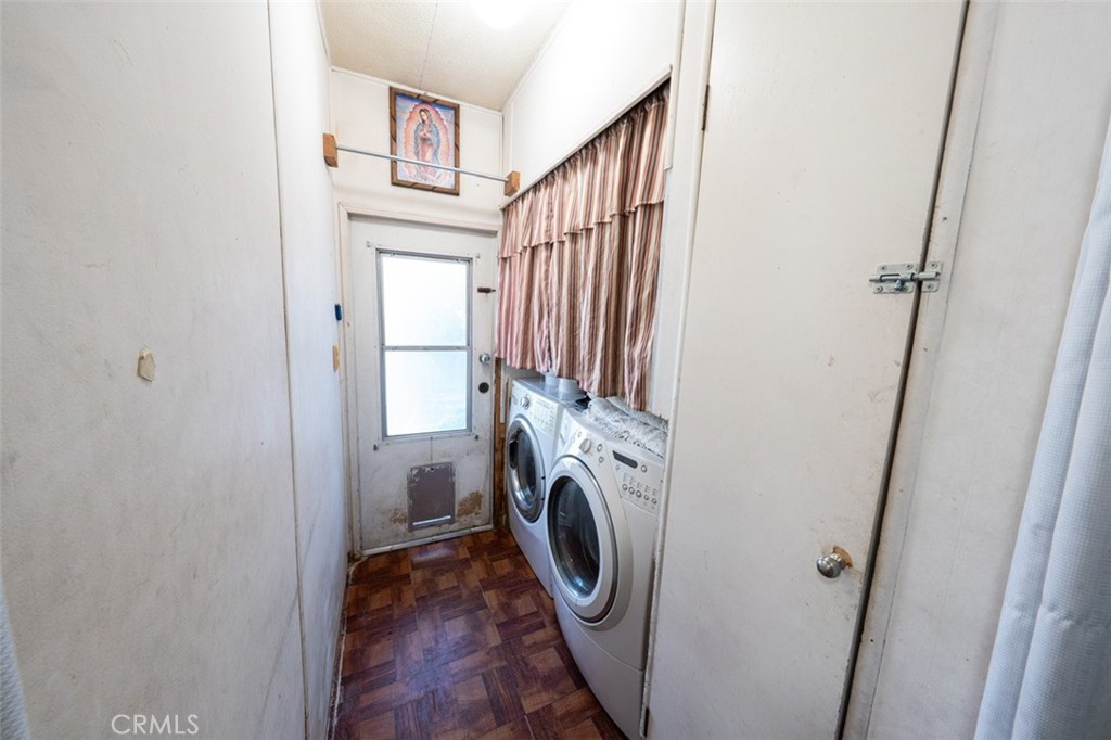 131 Colombo Lane Tustin, CA 92780 - Photo 12 of 19 a view of a hallway with washer and dryer