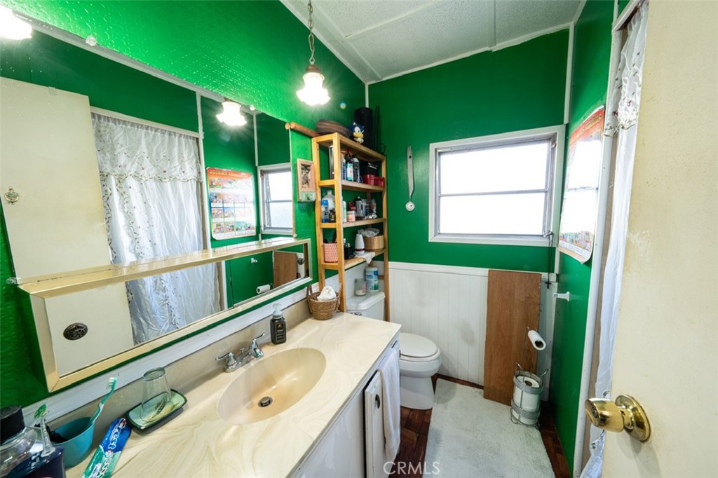 131 Colombo Lane Tustin, CA 92780 - Photo 14 of 19 a bathroom with a sink mirror vanity and toilet