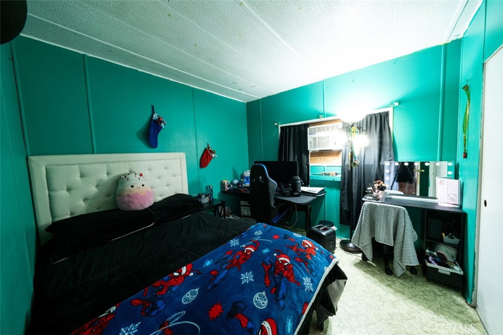 131 Colombo Lane Tustin, CA 92780 - Photo 16 of 19 a bedroom with a bed and a flat tv screen