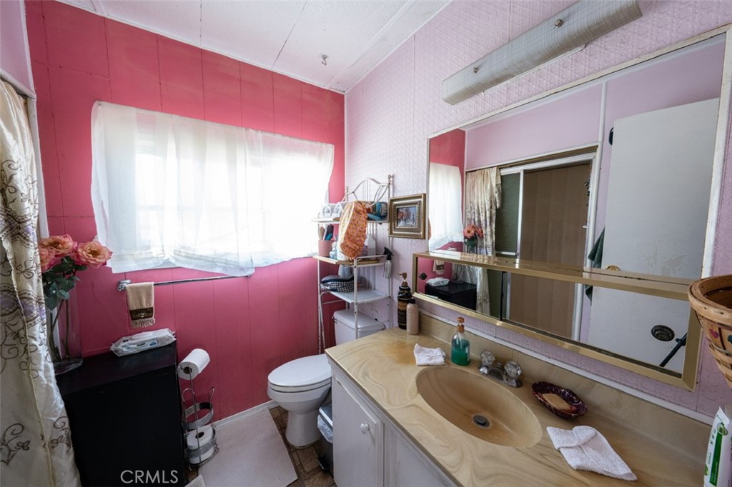 131 Colombo Lane Tustin, CA 92780 - Photo 17 of 19 a bathroom with a sink mirror vanity and toilet