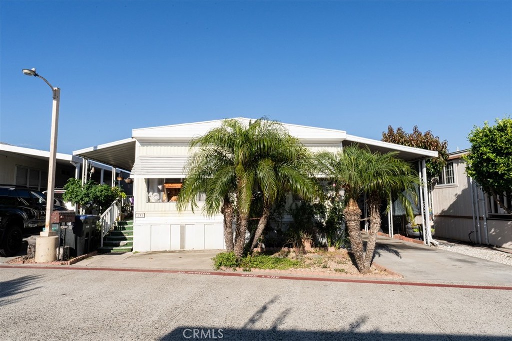 131 Colombo Lane Tustin, CA 92780 - Photo 2 of 19 a front view of a house with garden