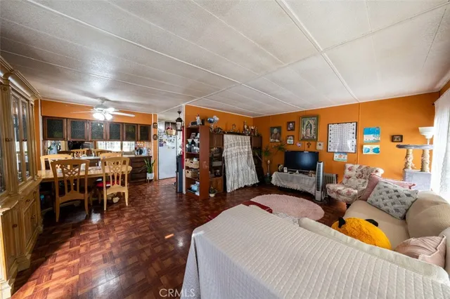 a living room filled with furniture and a large window
