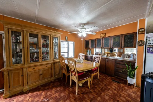 a dining area with furniture and window