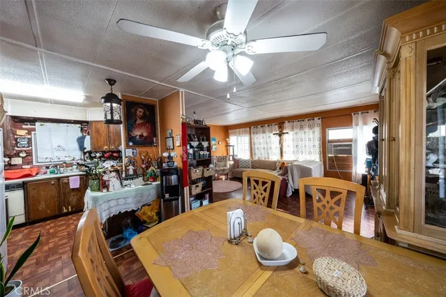 a view of a dining room with furniture window and outside view