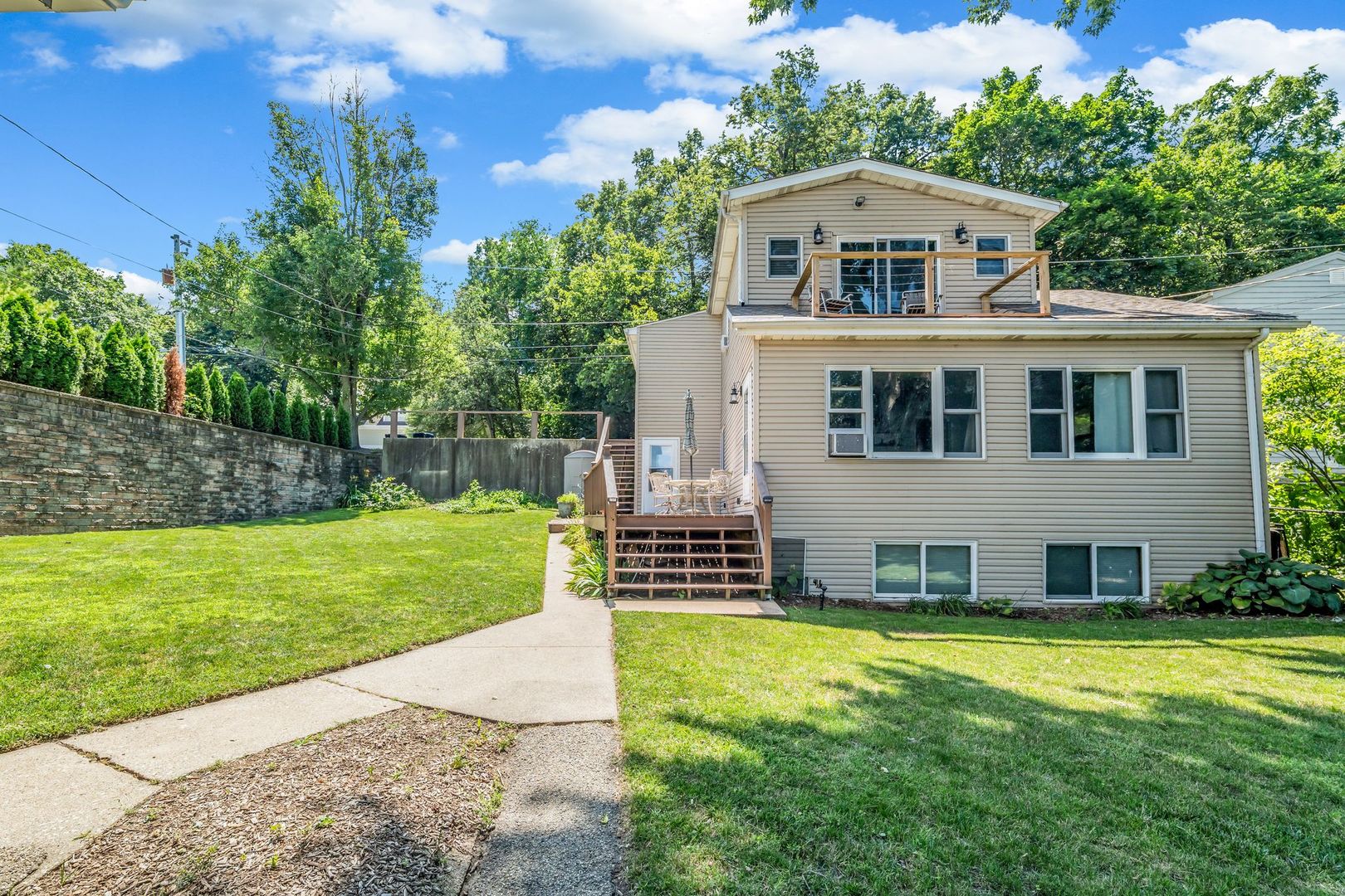 4018 Pitzen Road Johnsburg, IL 60051 - Photo 27 of 47 a front view of a house with garden