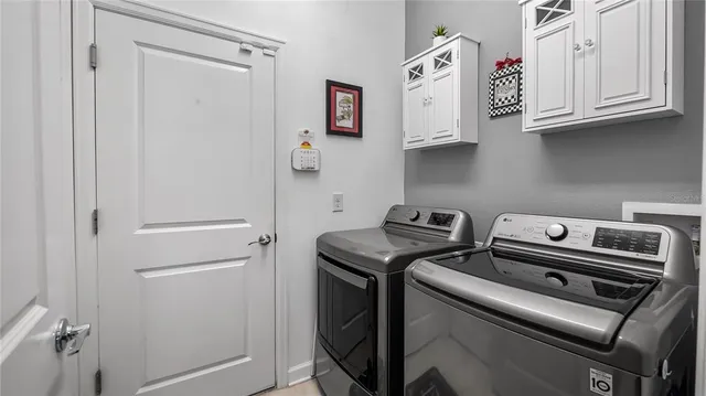 a view of storage and utility room with washer and dryer