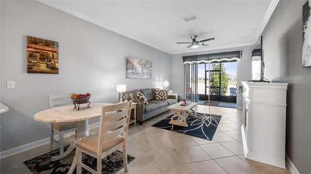 a living room with furniture a fireplace and a table