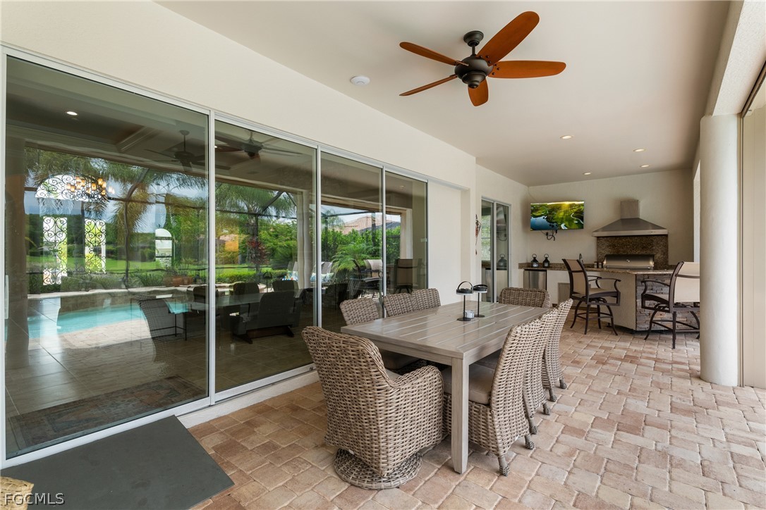 9383 Slate Court Naples, FL 34120 - Photo 19 of 28 a view of a dining room with furniture window and outside view