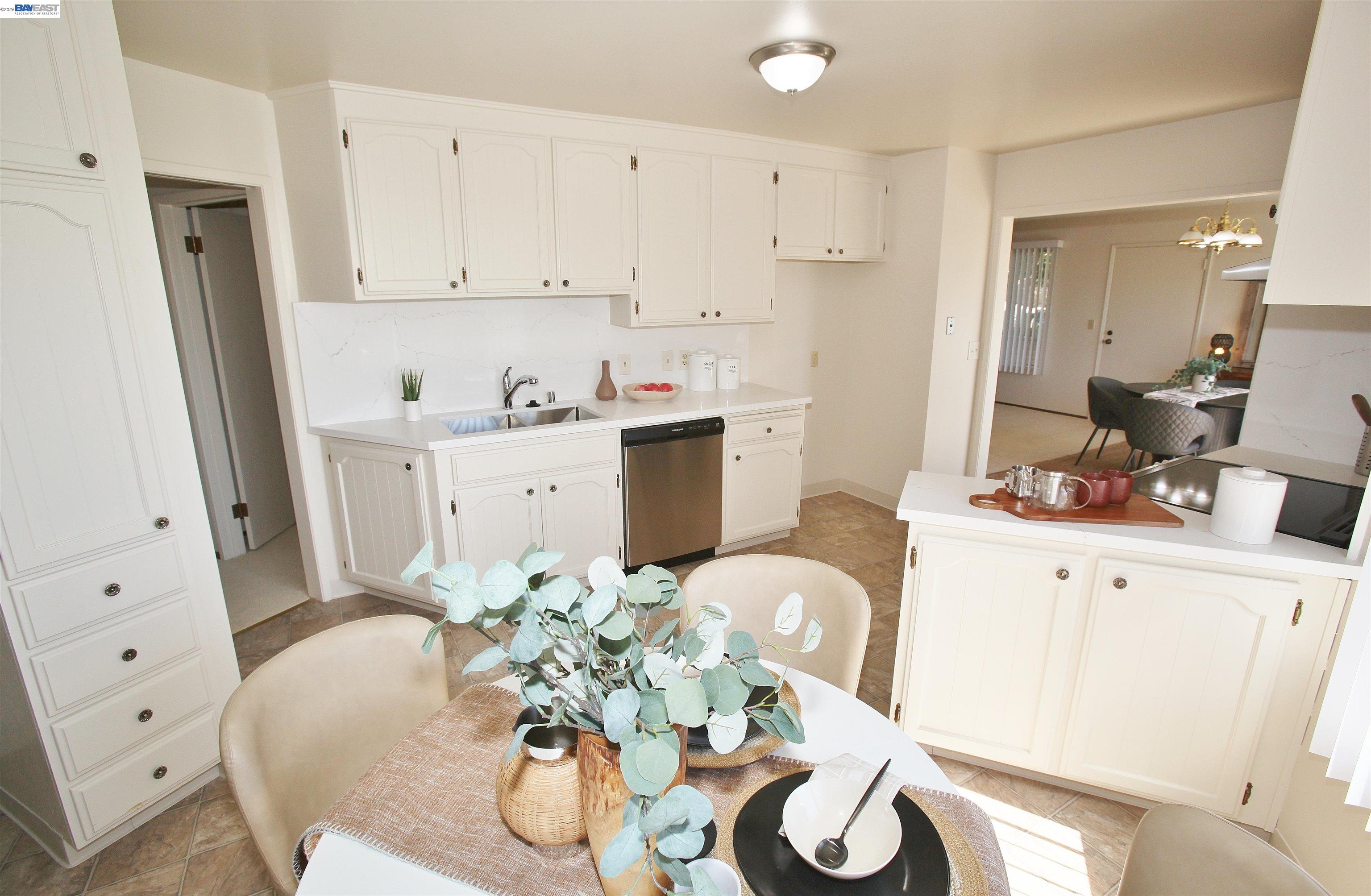 2728 Sheffield Place Castro Valley, CA 94546 - Photo 14 of 29 a kitchen with stainless steel appliances white cabinets and wooden floor