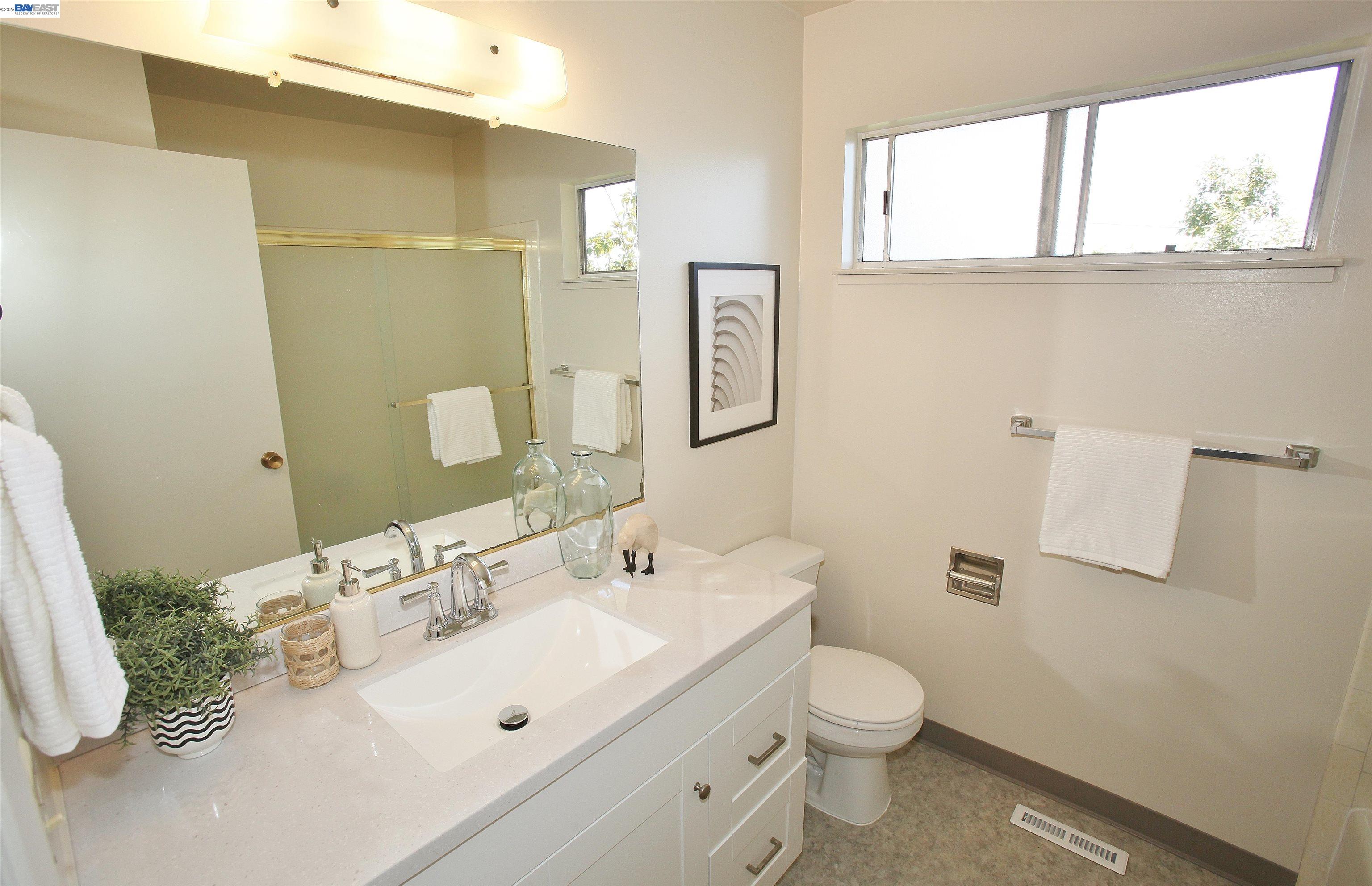 2728 Sheffield Place Castro Valley, CA 94546 - Photo 24 of 29 a bathroom with a sink a toilet and mirror