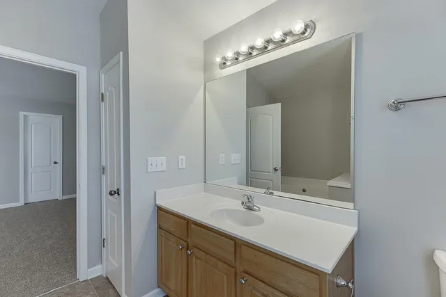 a bathroom with a sink double vanity and a mirror