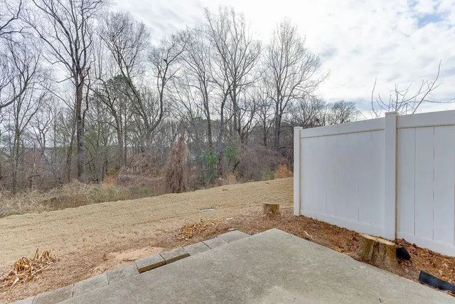 a view of a backyard of the house
