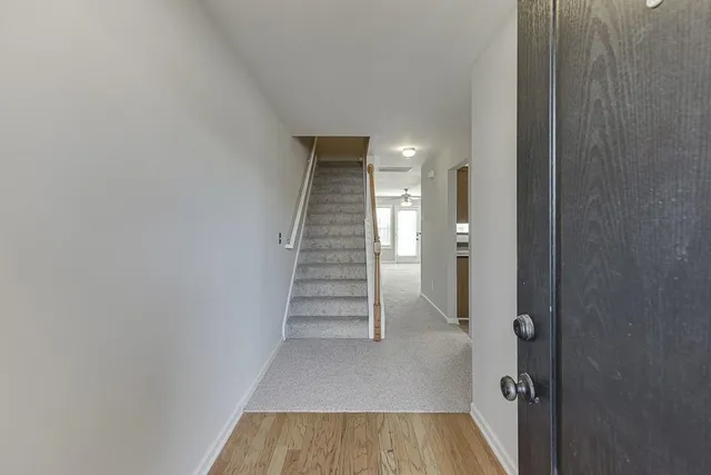 a view of entryway with wooden floor