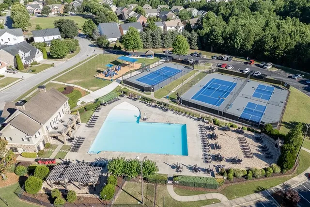 a view of a swimming pool with lounge chairs