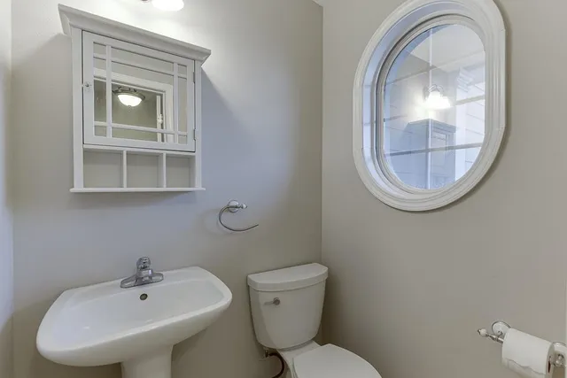 a bathroom with a toilet and a sink