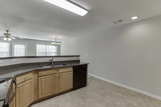 a kitchen with cabinets and sink